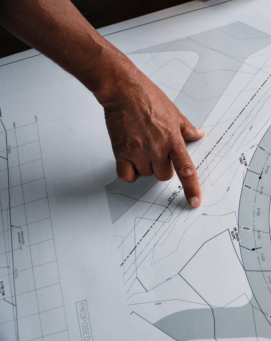 Prime Landscaping designer reviewing a grading and drainage plan for a Park City property