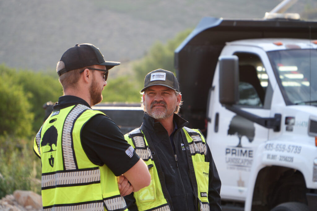Prime Landscaping Team discusses field project