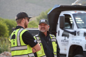 Prime Landscaping Team discusses field project